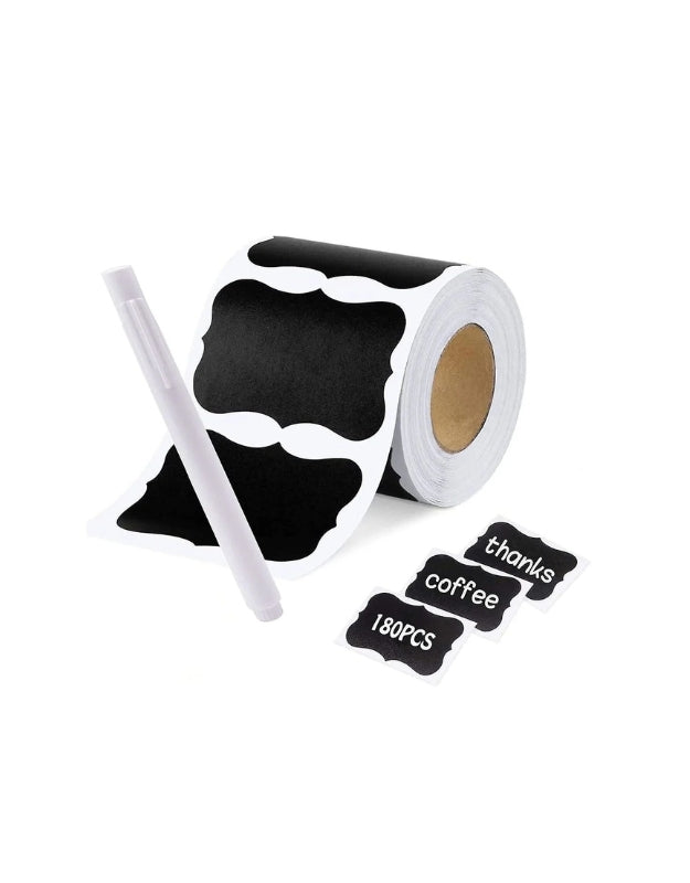 Roll of black chalkboard label stickers with white marker pen and labeled tags for jars and containers